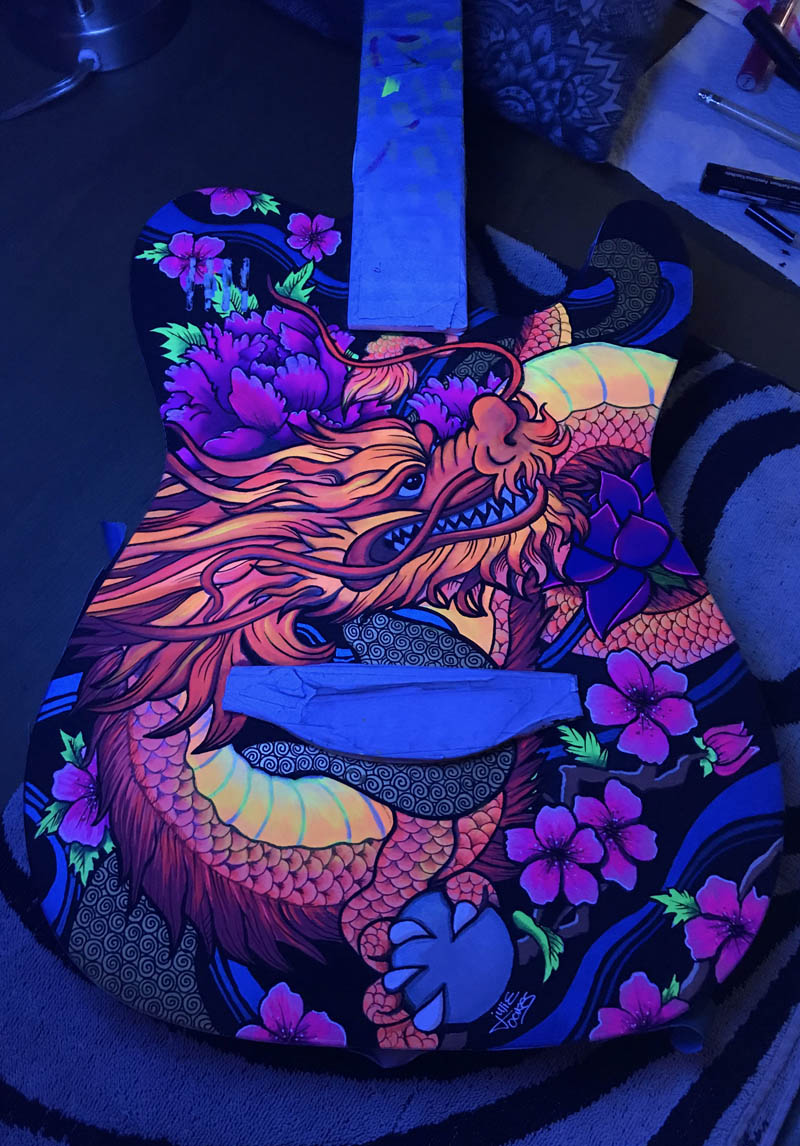 painted guitar with custom dragon design